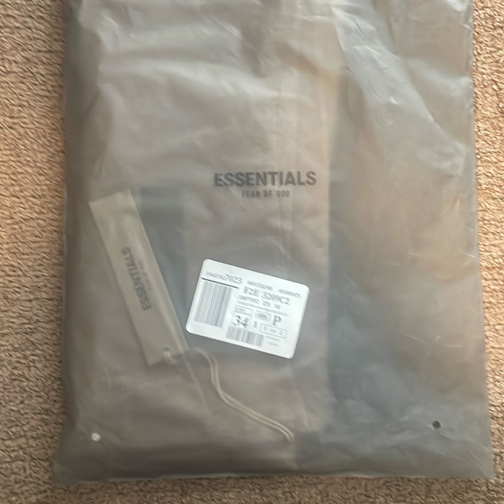 Essentials cream color size med but this thing is huge it has to be for 3x
